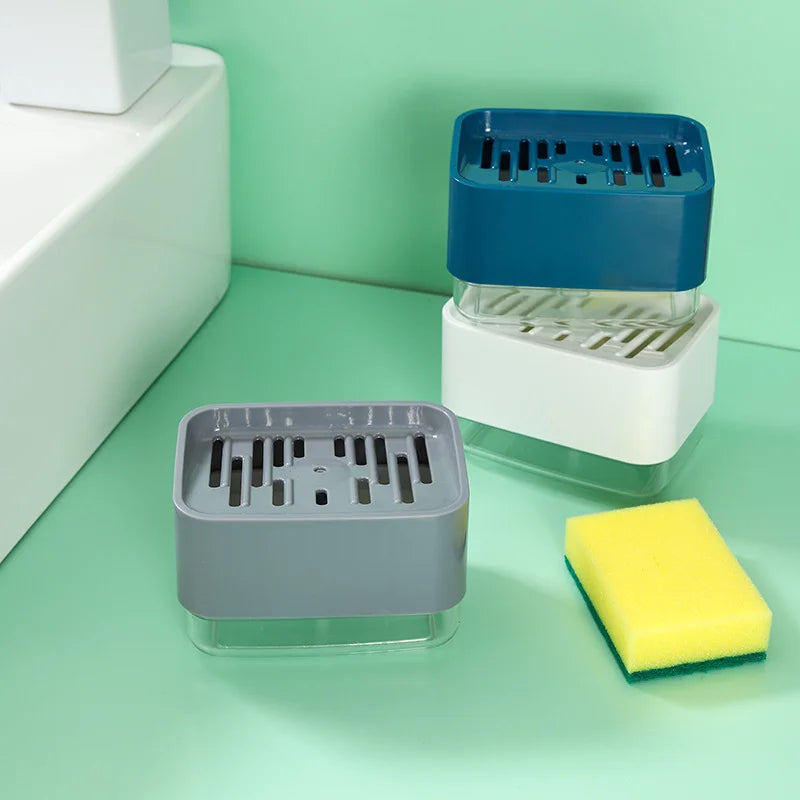A set of kitchen soap dispensers and a yellow sponge resting on a light green surface.