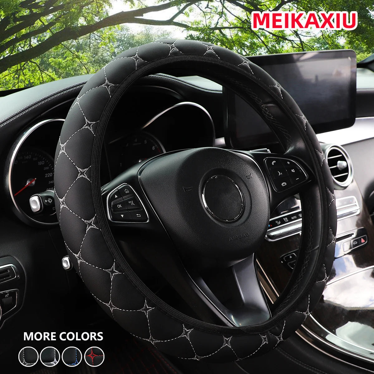 Close-up of a black embroidered leather steering wheel cover installed in a car interior.