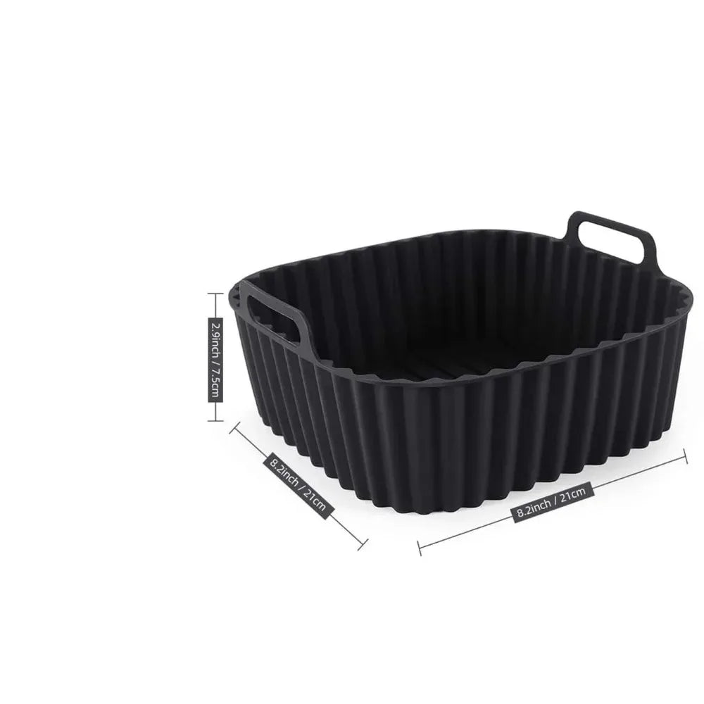 Black reusable silicone air fryer liner with ribbed texture.