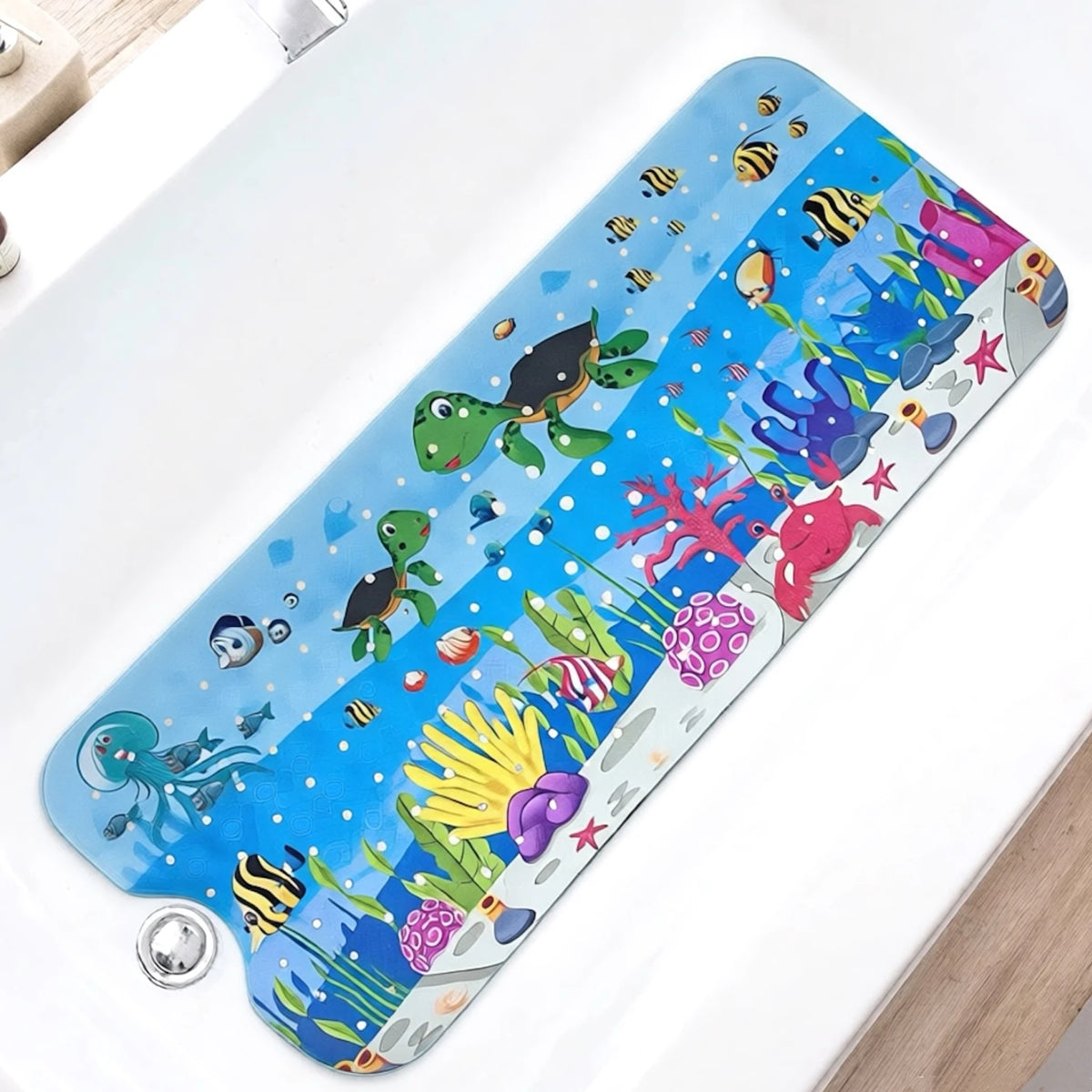A blue and green cartoon bathtub mat featuring various sea creatures like fish, crabs, and sea turtles.