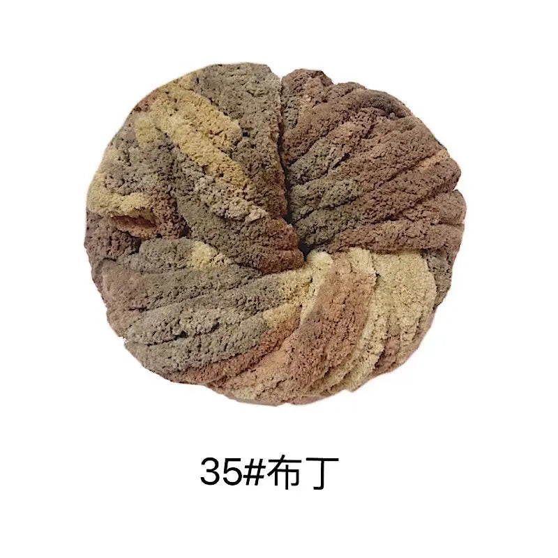 A ball of chunky acrylic yarn in a mottled brown and beige color.