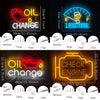 Neon sign displaying Oil Change text and instructions for a garage or man cave decor