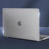 A silver laptop is shown with a protective case, featuring a subtle glitter effect and an Apple logo.