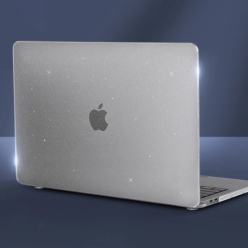 A silver laptop is shown with a protective case, featuring a subtle glitter effect and an Apple logo.