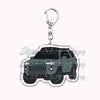 A durable metal keychain featuring a model of an off-road truck.