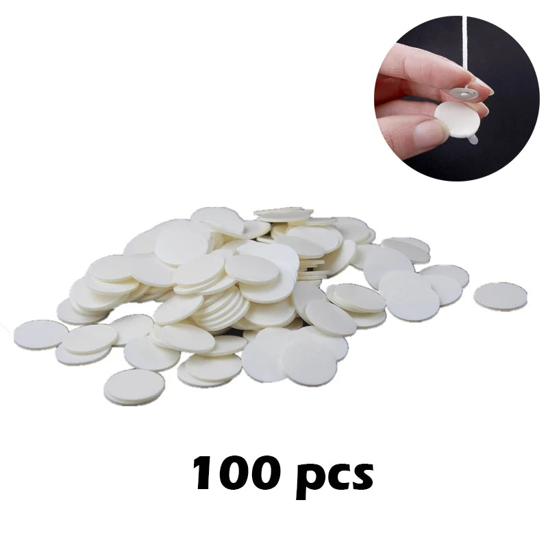 A pile of 100 white natural cotton candle wicks with metal stands.