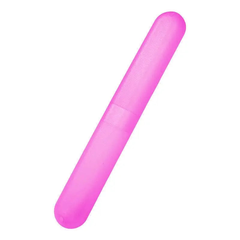A bright pink portable toothbrush travel case with a smooth, elongated design.