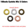 A collection of five different colored 4mm metal eyelets, including gold, silver, bronze, black, and rose gold.