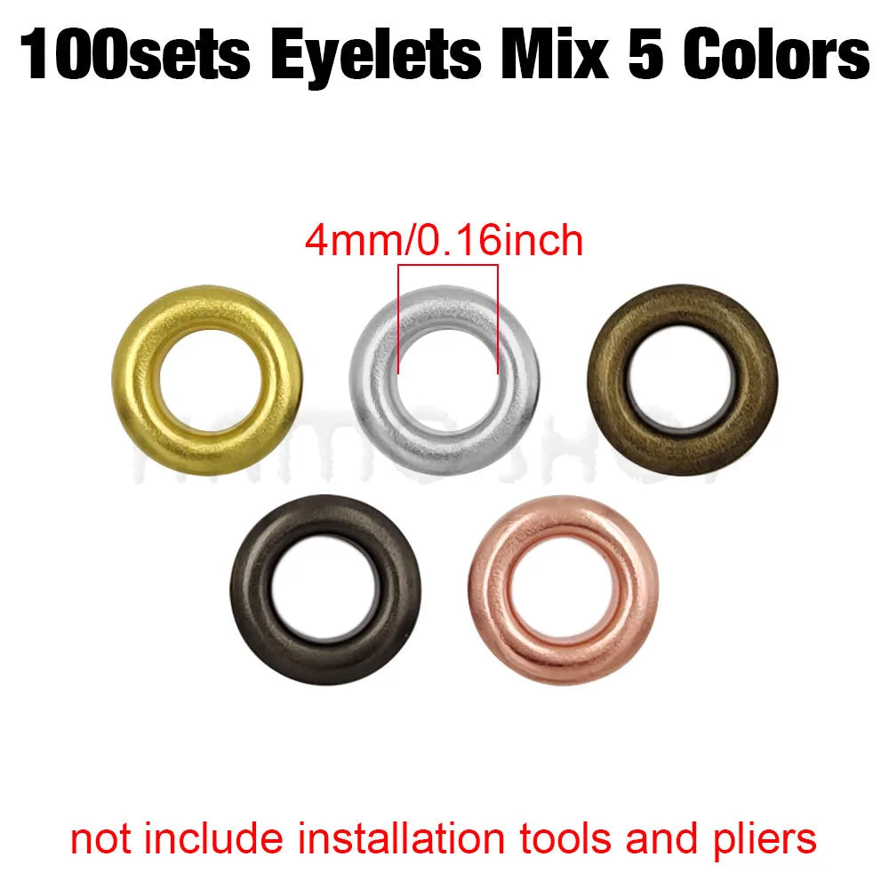 A collection of five different colored 4mm metal eyelets, including gold, silver, bronze, black, and rose gold.