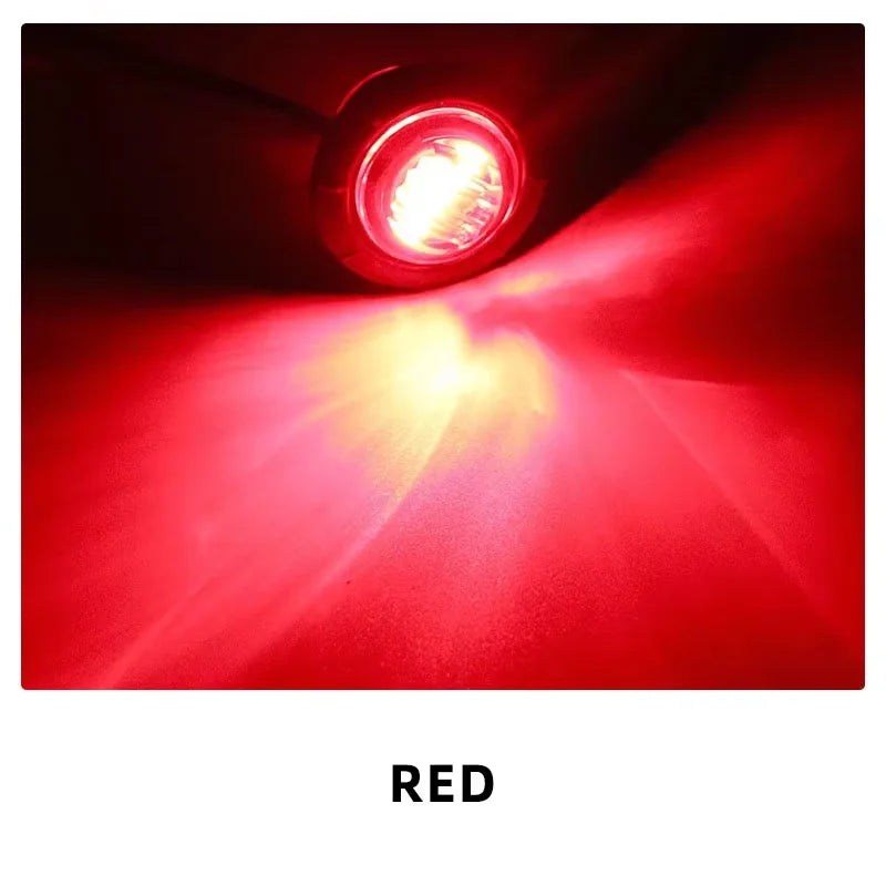 A bright red LED light beam shining forward from a round marker light.