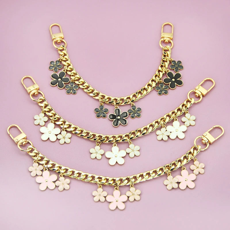 Gold and rose gold decorative chain necklace featuring flower charms for a phone strap