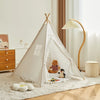 A white foldable play tent teepee with natural wood accents and curtains set up indoors on a light rug.