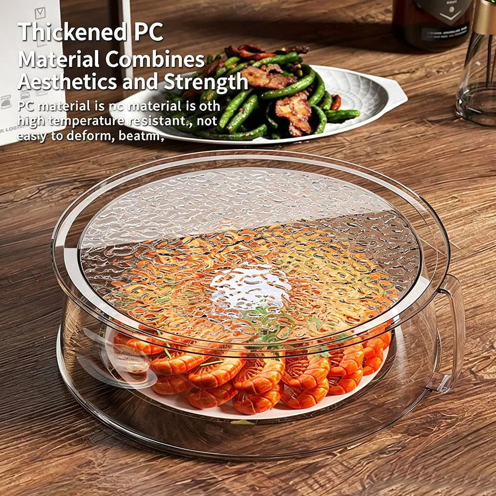 Clear microwave splatter cover with a heat-resistant handle shown over cooked food
