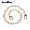 A strand of small, round white pearls used as a chain strap for bags or purses.