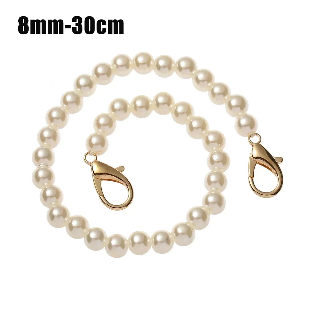 A strand of small, round white pearls used as a chain strap for bags or purses.