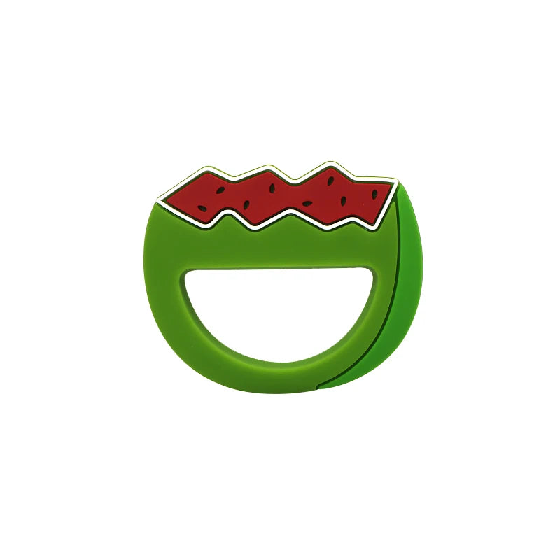 A green silicone baby rattle teether shaped like a sliced watermelon with red accents.