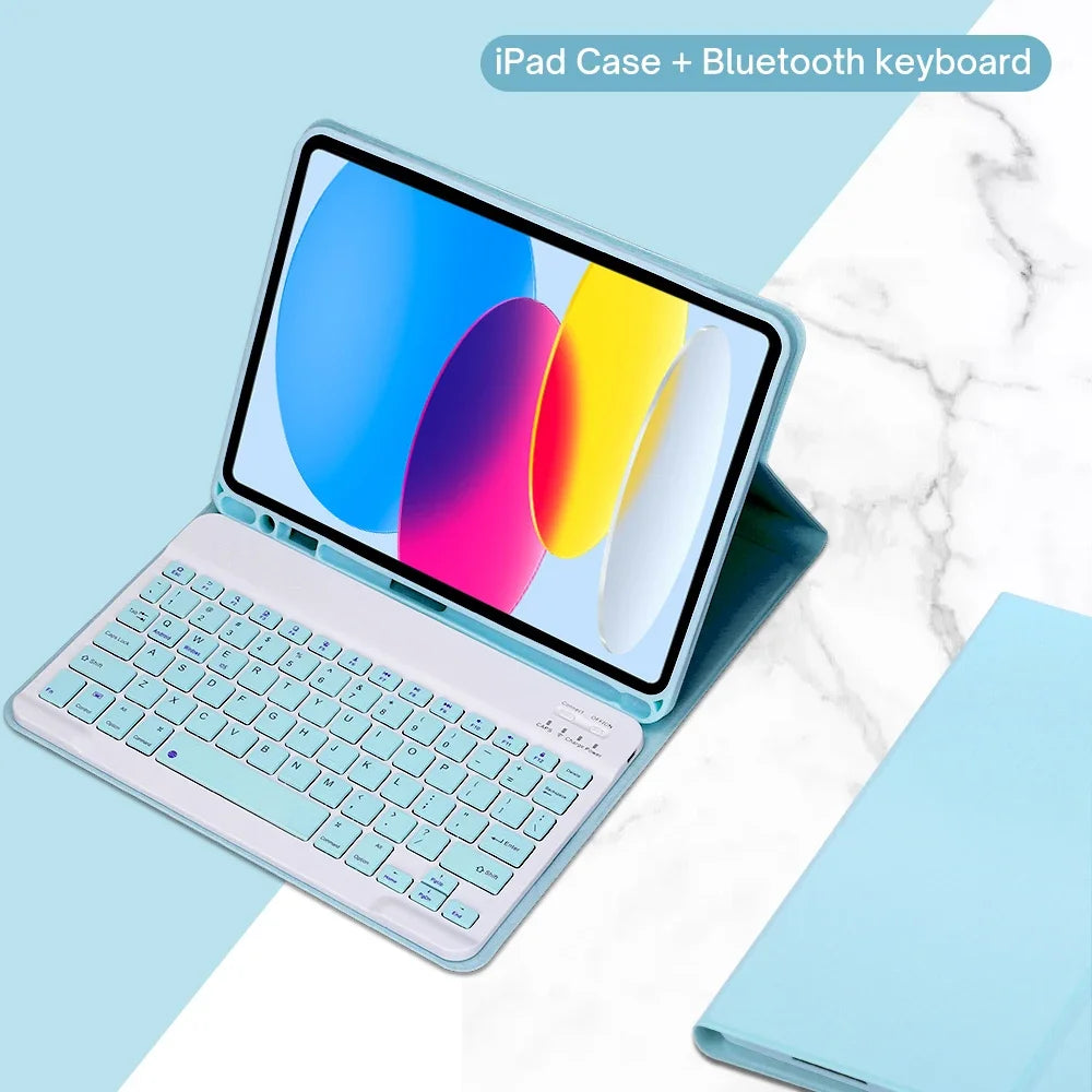 A light blue iPad case shown open with a detachable Bluetooth keyboard resting beside it on a white marble surface.