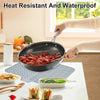 A silicone dish drying mat with a drainage ramp is shown under a cooking pan in a kitchen setting.