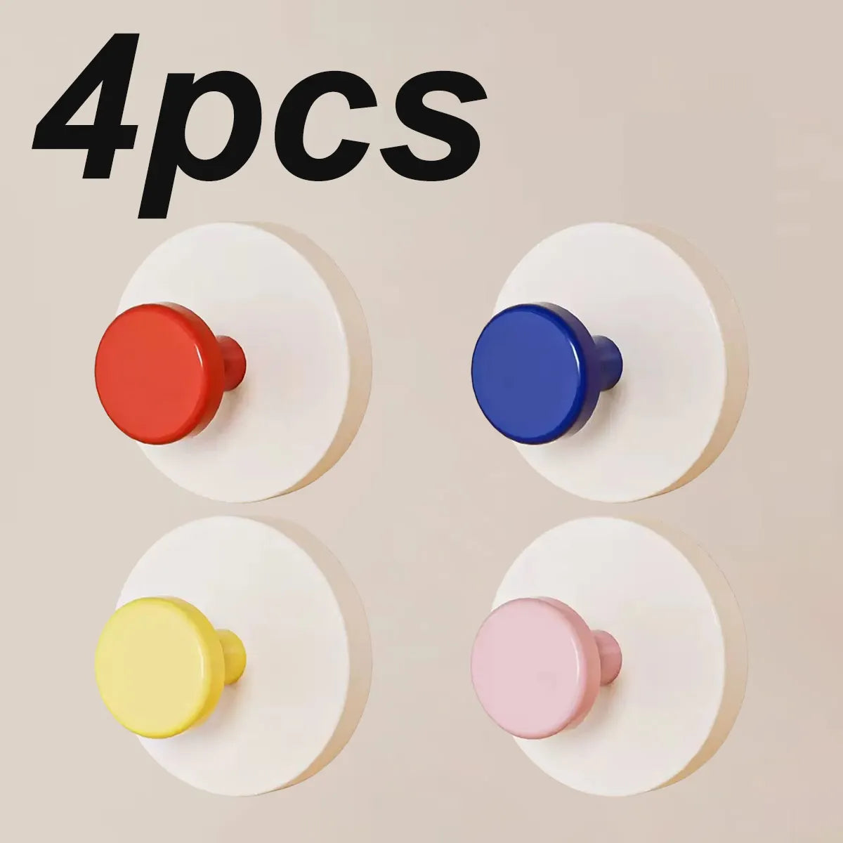 Four colorful suction cup hooks in red, blue, yellow, and pink displayed on a light background.