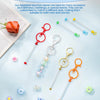 A collection of metal beadable keychain bars in various colors and styles displayed on a light blue background.