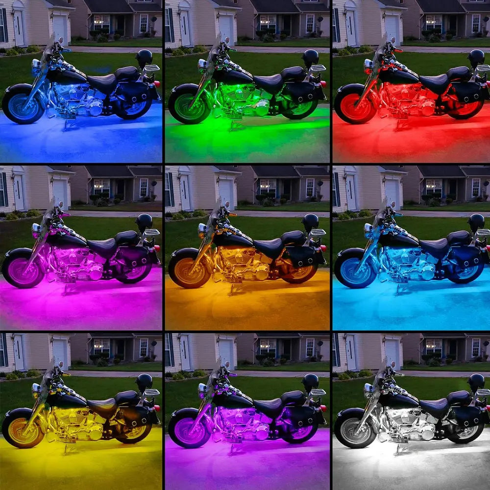 A collection of motorcycles illuminated by various colors of RGB LED strip lights.