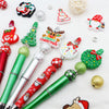 A craft kit featuring a beaded ballpoint pen and various Christmas-themed beads and ornaments.