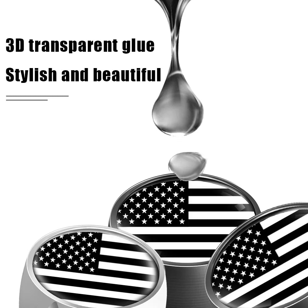 A set of four American flag tire valve caps featuring a black and white striped pattern with stars.