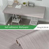 Roll of self-adhesive wood grain wallpaper showing a light gray textured pattern.