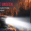 A powerful flashlight beam illuminates a forest landscape, highlighting features like fast Type-C charging and durable alumin