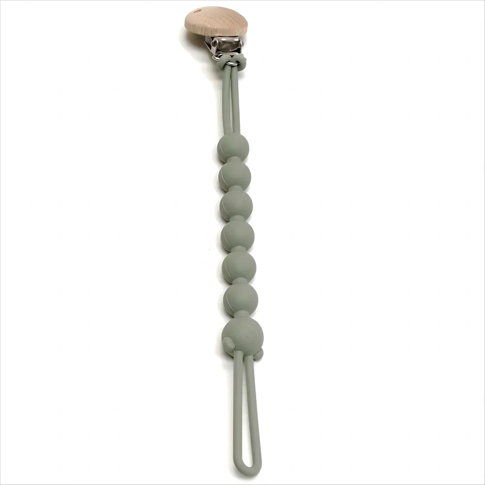 A food-grade silicone pacifier clip with an anti-lost chain, featuring a wooden top and a chain of small silicone beads.