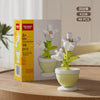 A box of K338 flower pot building blocks set containing 98 pieces of white flowers in green pots.