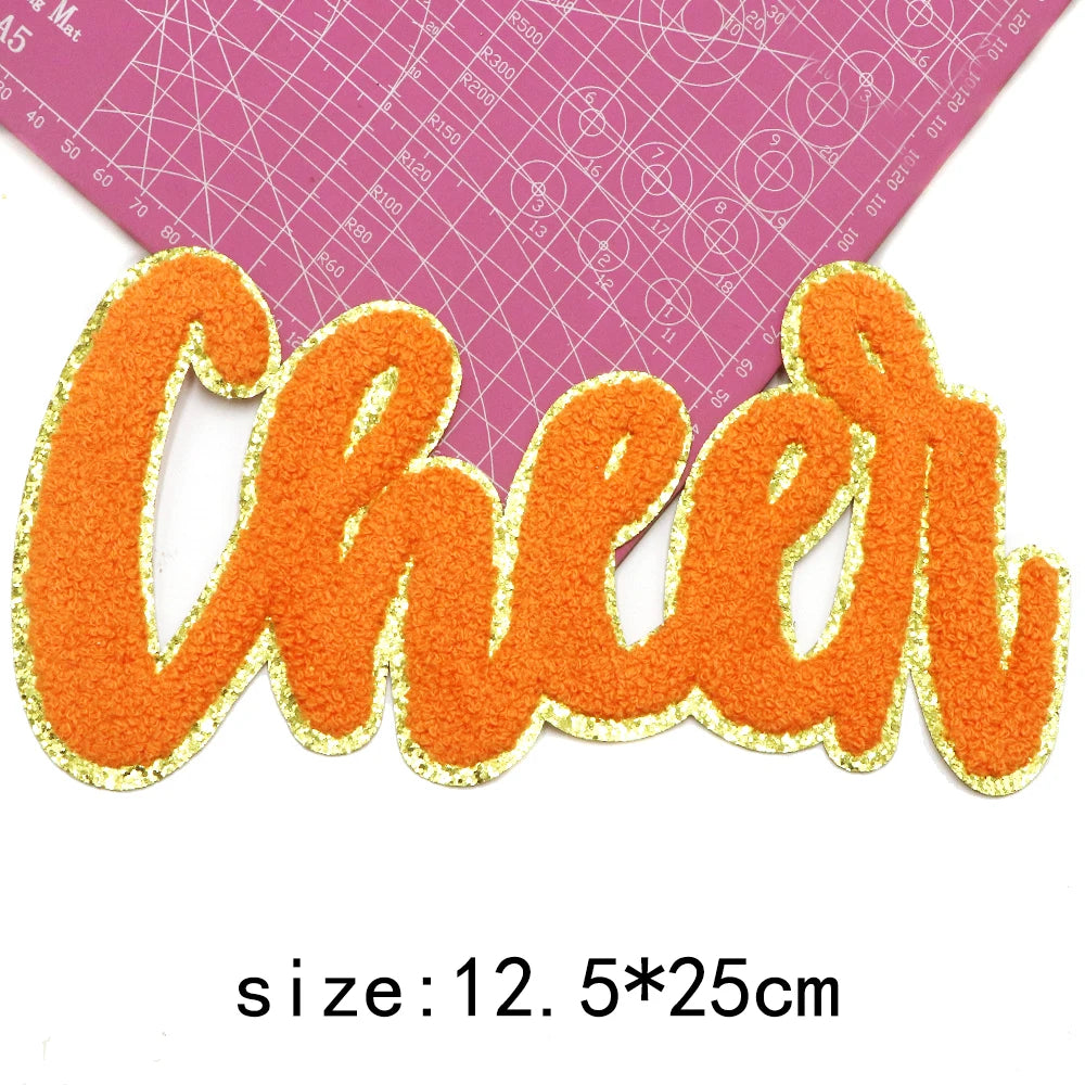Orange chenille letter patch spelling Cheer, size 12, measuring 5x25cm.