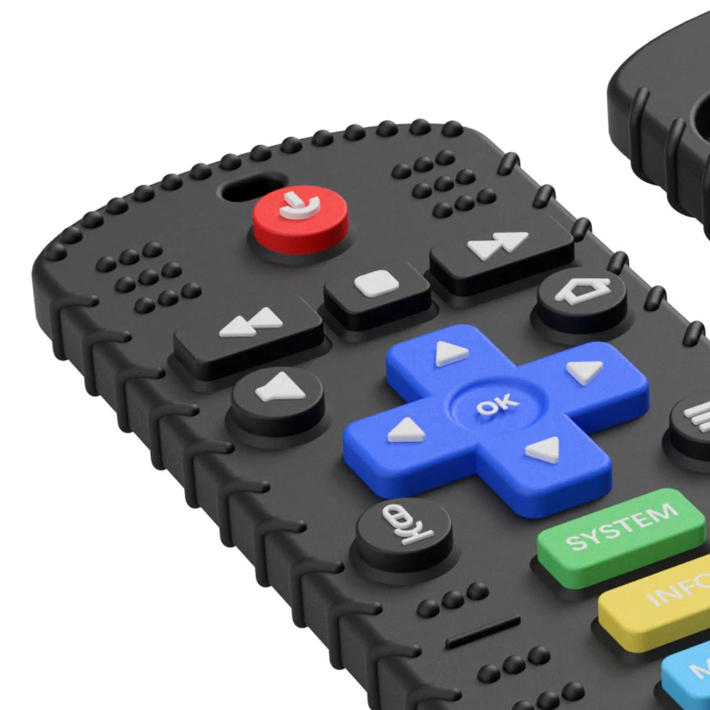 A close-up view of a black silicone remote control teether for babies with various buttons and a red switch.