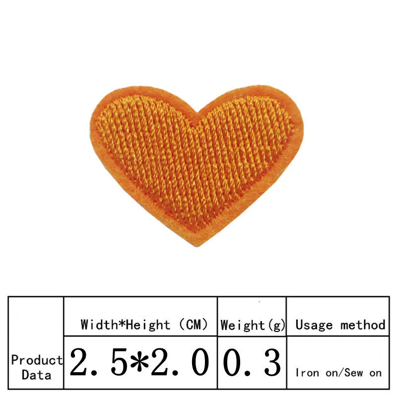 An orange heart shaped iron-on patch with a textured surface.