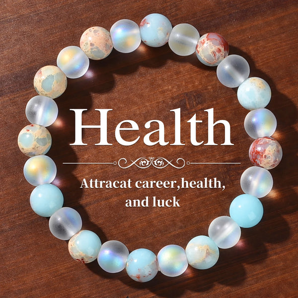 Bracelet perlé avec des perles de quartz iridescent et de sédiments marins, disposées en cercle.