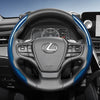 A black steering wheel with blue carbon fiber texture accents and controls in a car interior.