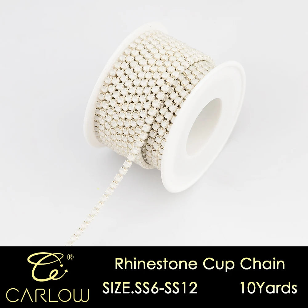 A spool of rhinestone cup chain in a gold color with 10 yards of material.