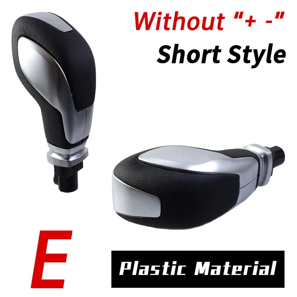Black plastic gear shift knob without plus or minus symbols in a short style