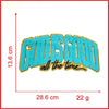 Embroidered God Is Good chenille iron-on patch in turquoise and gold thread.