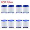 Eight white cylindrical filters with blue caps and rubber feet