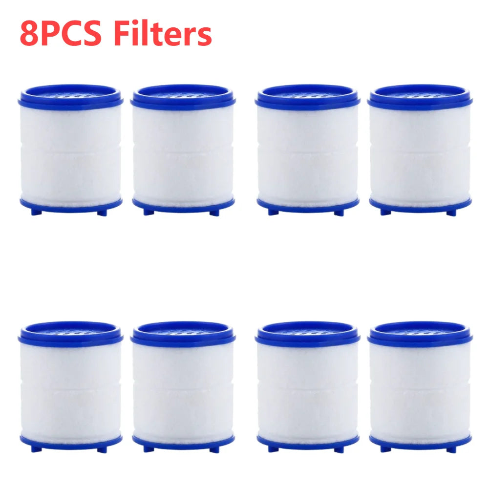 Eight white cylindrical filters with blue caps and rubber feet
