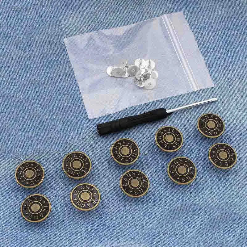 A collection of silver instant no-sew snap buttons laid out on a translucent white bag.