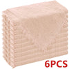 A stack of six raw-edge, light pink polyester cloth napkins.