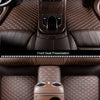 Close-up views of front and rear seat presentations showing quilted brown leather car floor mats.