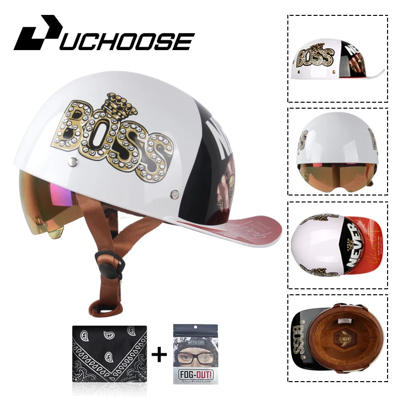 A white motorcycle helmet with a black visor and gold Boss logo, shown alongside accessories like a cap and leather helmet co