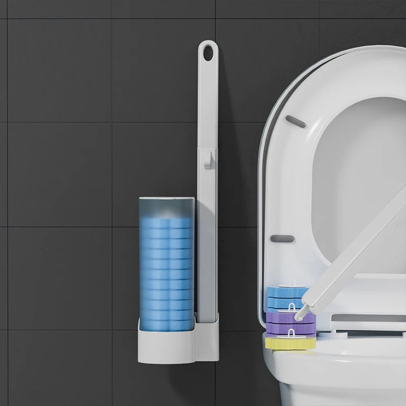 A white wall-mounted holder for a disposable toilet brush set with blue and purple brushes.