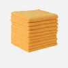 A stack of bright yellow cleaning towels or cloths.