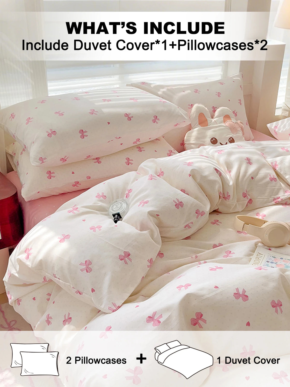 A set of pink and white bedding including a duvet cover and two pillowcases with tiny pink bow prints.
