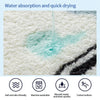 Close-up of a white plush carpet demonstrating water absorption and quick drying, showing a wet area and a black striped sect