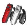 A black USB rechargeable bicycle tail light with a red and clear lens is shown.